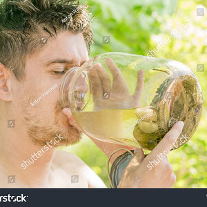 stock-photo-man-is-drinking-the-brine-from-the-jar-with-pickled-cucumbers-605757422.jpg